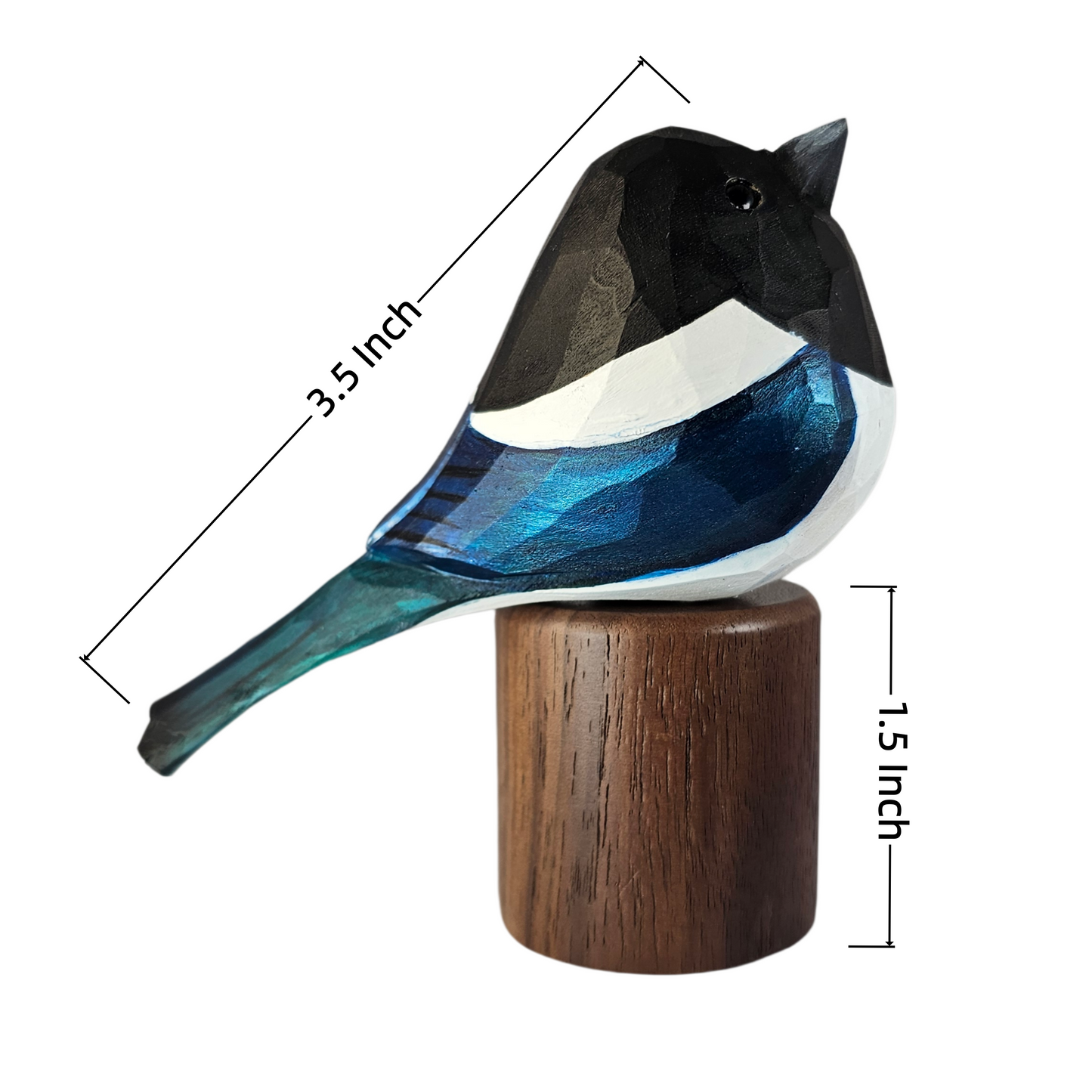 A small Eurasian magpie figurine with a geometric faceted design, featuring a black head, white chest, blue and teal body, and a brown wooden base, shown with dimension lines indicating 3.5 inch length and 1.
