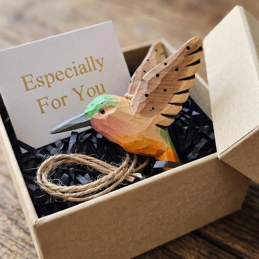 Hand-carved wooden hummingbird ornament packaged in a craft gift box with a card reading "Especially For You".