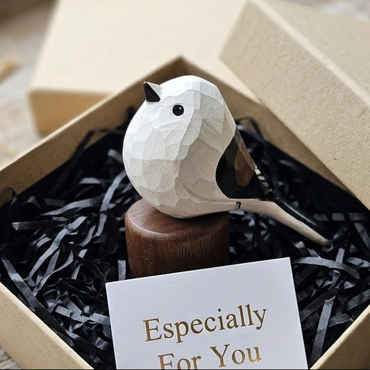 A small white geometric Long-tailed-tit figurine displayed inside a kraft gift box with black shredded paper filler and a card that reads 'Especially For You'.
