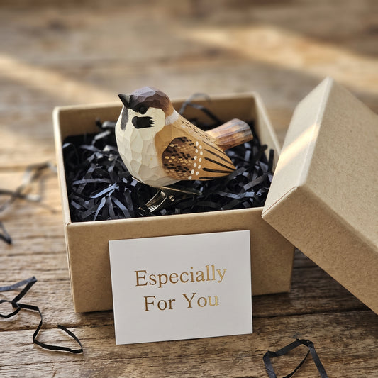 Hand-carved wooden sparrow ornament packaged inside a gift box