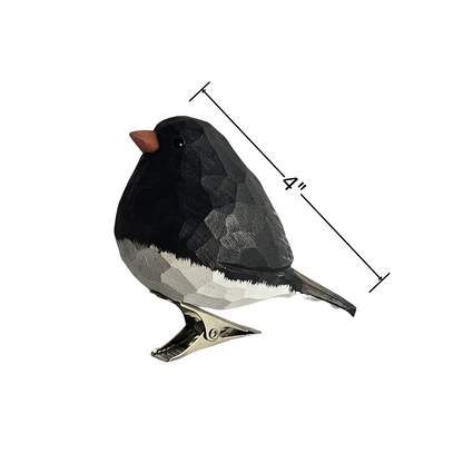 Hand-carved wooden Dark-Eyed Junco clip-on ornament with a 4-inch dimension line shown along its back, standing on a metal clip against a plain white background.