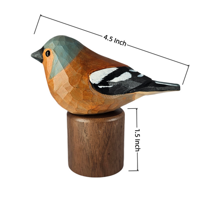 A faceted wooden Eurasian chaffinch sculpture on a cylindrical wooden base, shown with dimension lines indicating a length of 4.5 inch and height of 1.