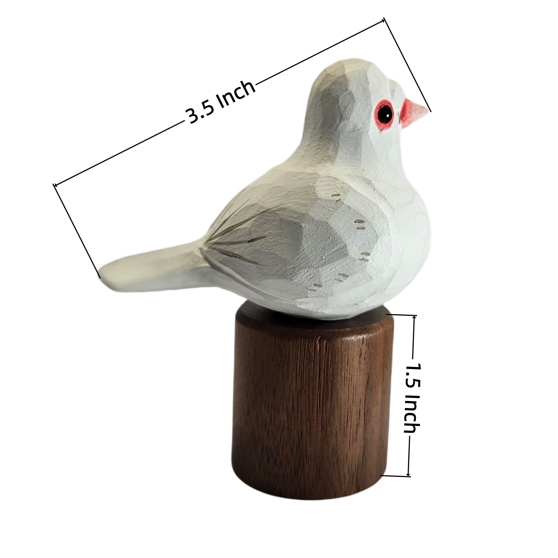 A small carved Pigeons figurine with a white body, red eye, and pink beak, mounted on a dark brown cylindrical base. Black measurement lines and text indicate dimensions of 3.