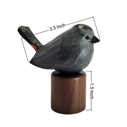 A carved wooden Gray Catbird figurine with a dark charcoal gray body and a brown cylindrical base, shown on a white background with overlaid dimension lines indicating 3.5 inch length and 1.