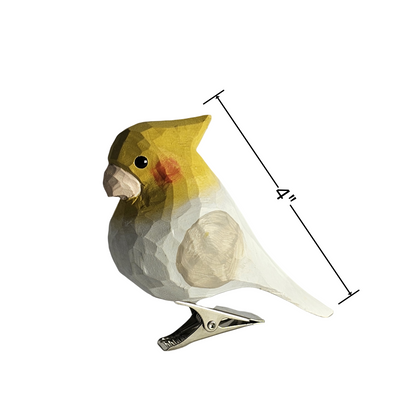 Size diagram of a hand-carved wooden cockatiel clip-on ornament showing a length measurement of 4 inches