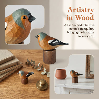 A collage showing a hand-carved wooden Eurasian chaffinch figurine in multiple settings. The main product is a small carved bird sculpture with orange-brown wood, muted blue-gray head, black beak, and black-and-white wings, mounted on a cylindrical wooden base.