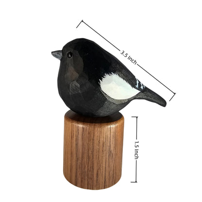 A painted Lark bunting figurine on a cylindrical wooden base, shown with dimension lines and text indicating a total height of 3.5 inch and base height of 1.