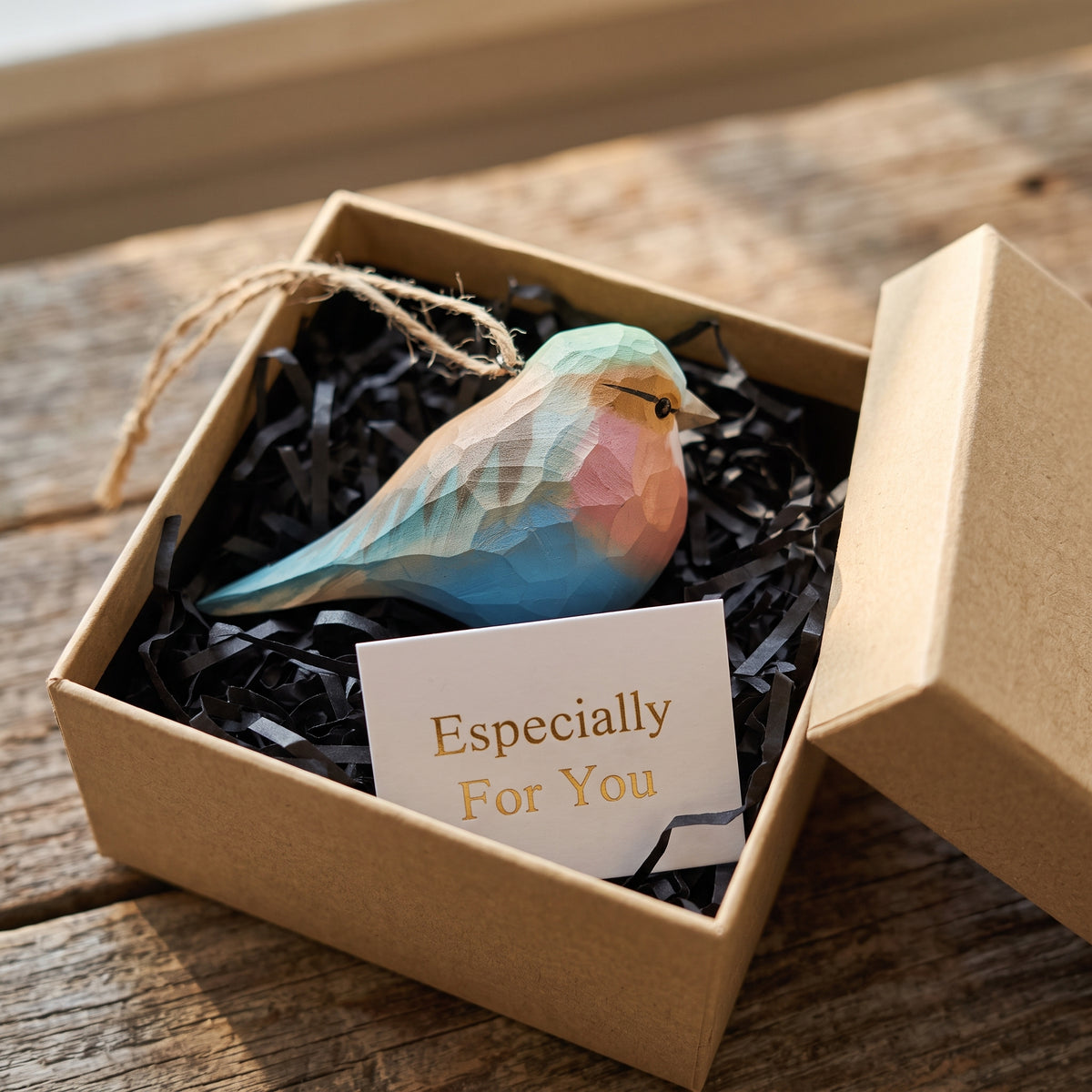 Hand-carved basswood Lilac-Breasted Roller ornament in a kraft gift box with an "Especially For You" card