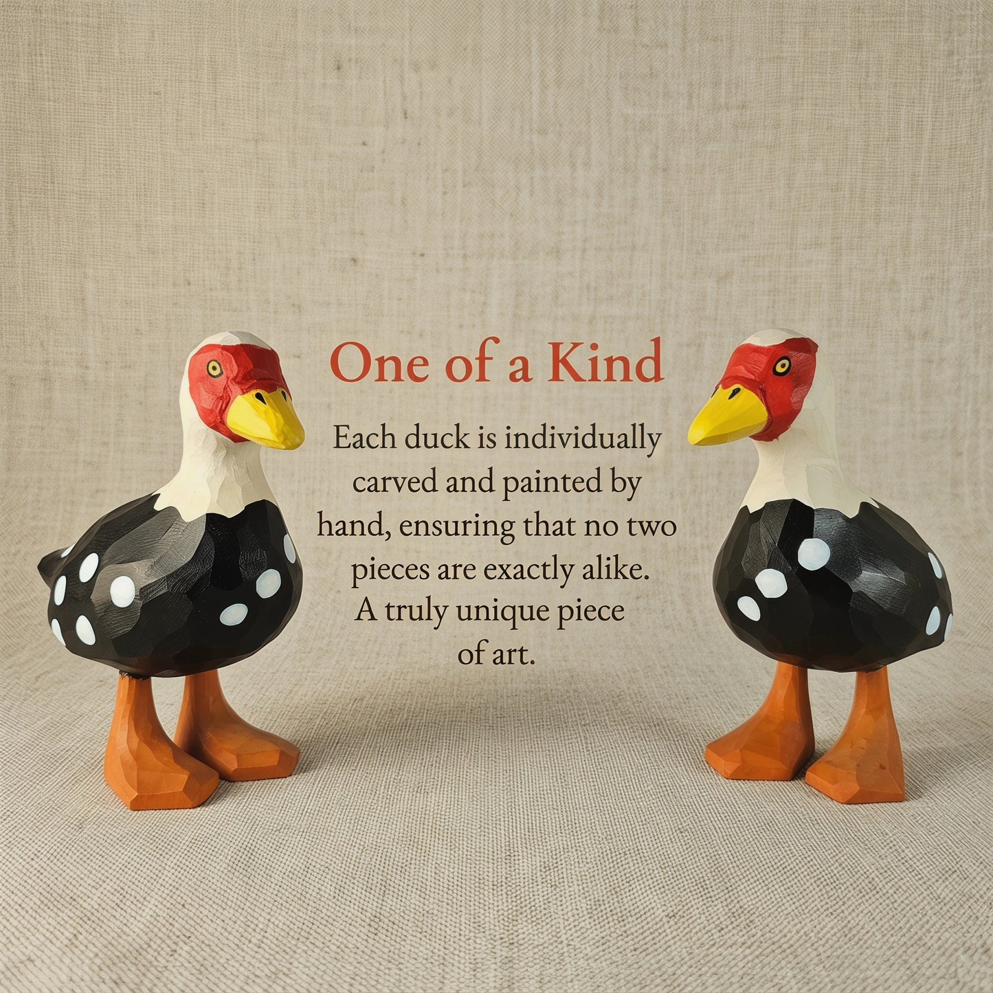 Two hand-carved wooden Muscovy Duck figurines standing side by side, highlighting their unique handmade details with the text "One of a Kind: Each duck is individually carved and painted by hand."