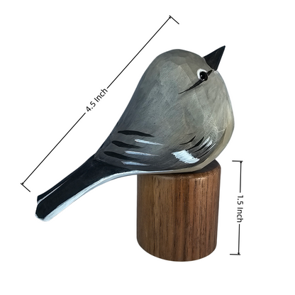 A painted wooden Northern mockingbird sculpture perched on a cylindrical wooden base, shown on a white background with dimension lines indicating 4.5 inches in length and 1.