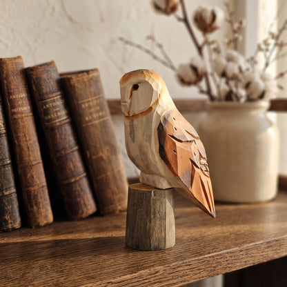 Handcrafted 4.5-inch wooden barn owl statue displayed on a rustic wooden shelf with antique books and dried cotton bolls