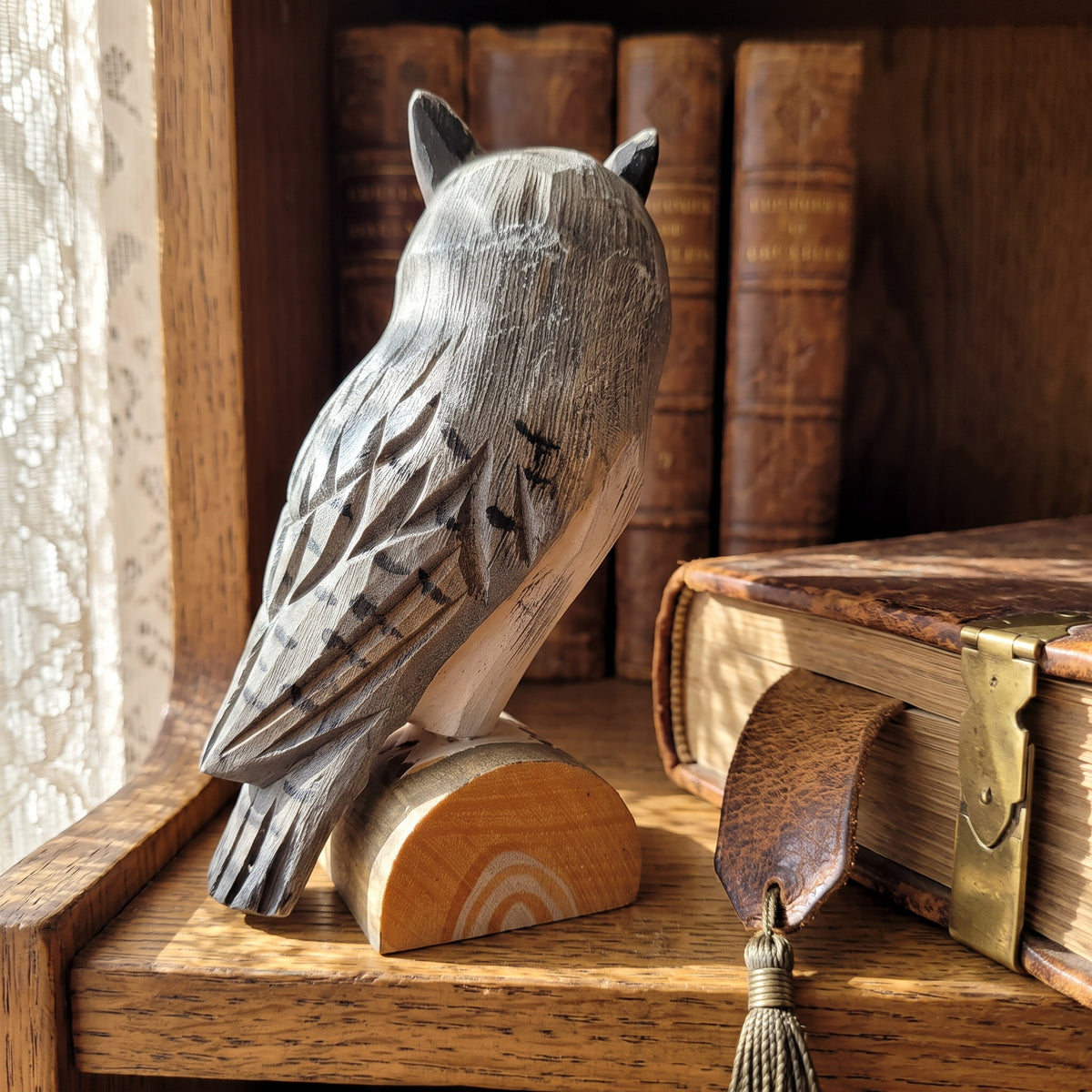 Hand-painted facial feather detail on basswood Northern white-faced owl sculpture