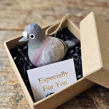 Hand-carved basswood baby pigeon ornament packaged in a gift box with a card reading "Especially For You."