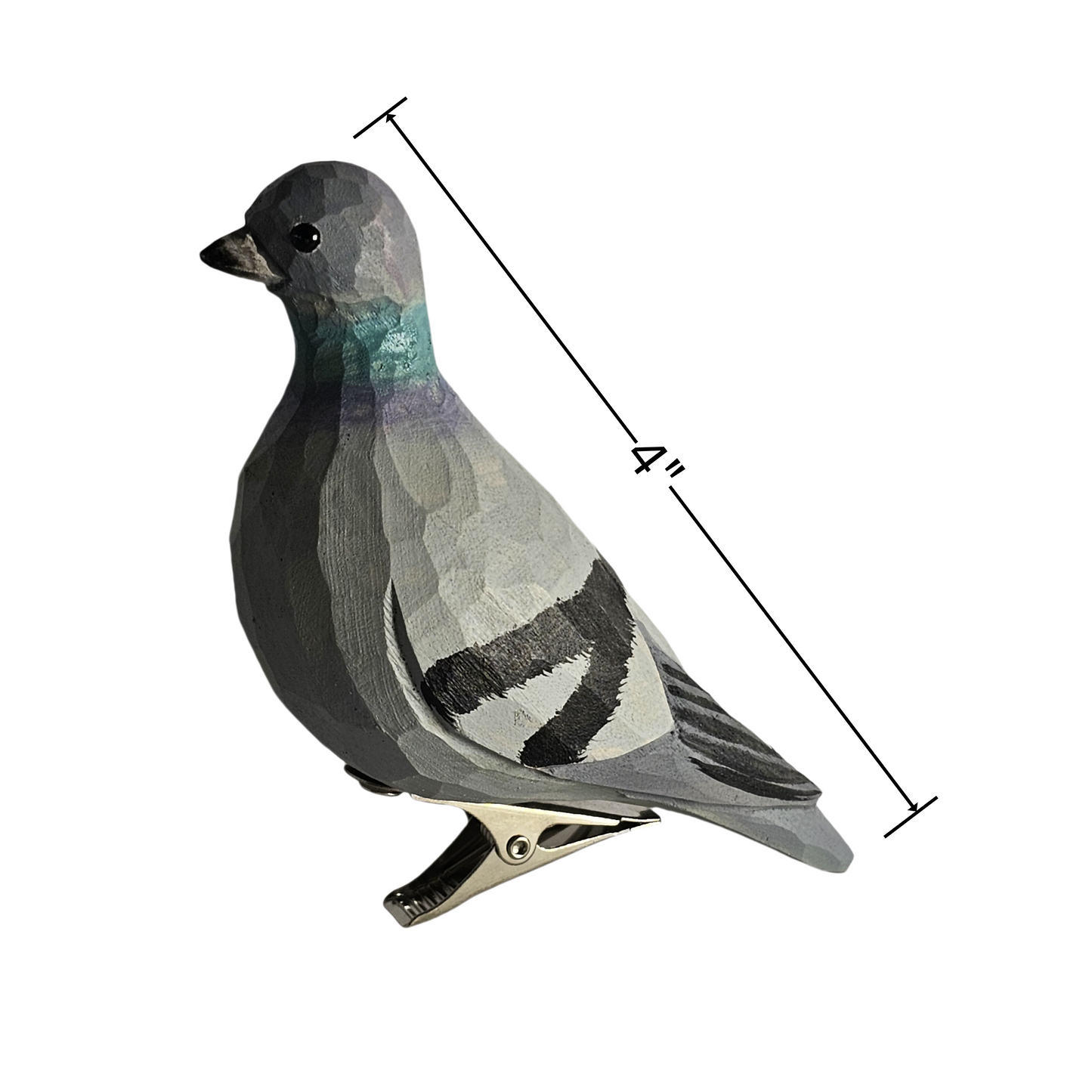 Side profile view of a hand-carved, hand-painted wooden Rock Dove (pigeon) bird clip-on ornament mounted on a metal spring clip against a clean white background, with a dimension line indicating a length of 4 inches.