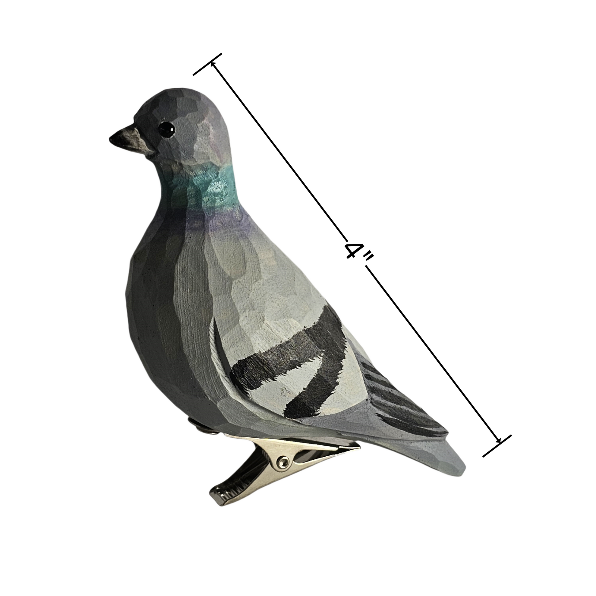 Side profile view of a hand-carved, hand-painted wooden Rock Dove (pigeon) bird clip-on ornament mounted on a metal spring clip against a clean white background, with a dimension line indicating a length of 4 inches.