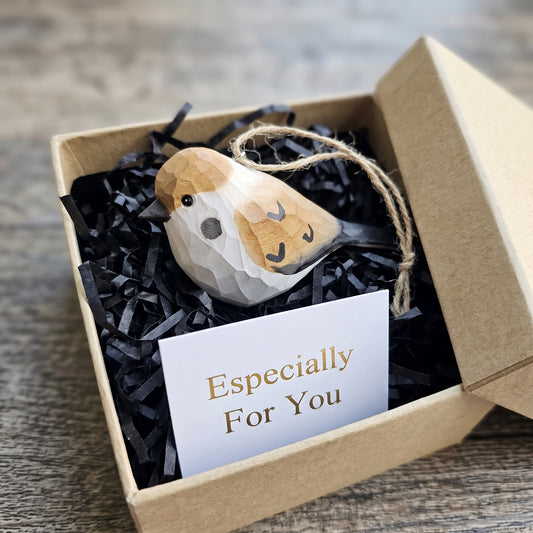 Hand-carved basswood sparrow hanging ornament inside a kraft gift box with an "Especially For You" card