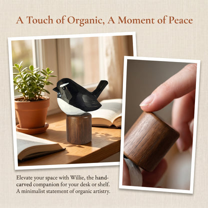 A hand-carved wooden Willie wagtail figurine displayed on a wooden stand on a desk next to a potted plant and open book, with a close-up of a hand holding a matching wooden object. Text at the top reads 'A Touch of Organic, A Moment of Peace' and descriptive copy below.